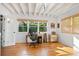 Bright home office with hardwood floors, exposed beam ceiling, and natural light at 6255 Lakeview Dr, Buford, GA 30518