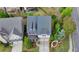 Aerial shot of a well-maintained home with manicured landscaping, a gray roof, and a paved driveway at 11210 Easthaven Pl, Duluth, GA 30097