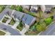 An aerial view shows a well-maintained home with a blue roof and manicured landscaping at 11210 Easthaven Pl, Duluth, GA 30097