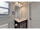 Bathroom featuring a vanity with a sink and mirror, a toilet, and a nearby door at 11210 Easthaven Pl, Duluth, GA 30097