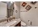 Elegant bathroom with granite countertop, modern fixtures, decorative mirrors, and a glass-enclosed shower at 11210 Easthaven Pl, Duluth, GA 30097