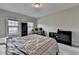 Neutral bedroom featuring gray walls, plush carpet, large window, and a workspace at 11210 Easthaven Pl, Duluth, GA 30097