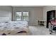 Neutral bedroom featuring gray walls, plush carpet, large window and desk area at 11210 Easthaven Pl, Duluth, GA 30097
