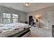 Neutral bedroom featuring gray walls, plush carpet, large window and desk area at 11210 Easthaven Pl, Duluth, GA 30097