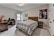 Neutral bedroom featuring gray walls, plush carpet, large window, and desk area at 11210 Easthaven Pl, Duluth, GA 30097