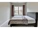 Comfortable bedroom with a large window, neutral colors, and plush carpeting, creating a relaxing atmosphere at 11210 Easthaven Pl, Duluth, GA 30097