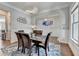 Bright dining room featuring an eye-catching chandelier and wainscoting at 11210 Easthaven Pl, Duluth, GA 30097