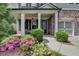 Inviting front porch with seating and landscaped garden showcasing the home's entrance at 11210 Easthaven Pl, Duluth, GA 30097