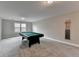 Game room with pool table, grey walls and carpet. Perfect for entertaining guests! at 11210 Easthaven Pl, Duluth, GA 30097