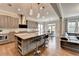 Open kitchen boasts a large island with barstool seating and stainless steel appliances at 11210 Easthaven Pl, Duluth, GA 30097