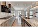 Open kitchen has stainless appliances, granite countertops and hardwood floors at 11210 Easthaven Pl, Duluth, GA 30097