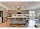 Open kitchen boasts a large island with barstool seating and stainless steel appliances at 11210 Easthaven Pl, Duluth, GA 30097
