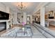Large living area open to the kitchen, featuring modern furnishings and design at 11210 Easthaven Pl, Duluth, GA 30097
