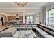 Expansive living room flowing into the kitchen, featuring contemporary decor and finishes at 11210 Easthaven Pl, Duluth, GA 30097