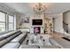 Comfortable living room with a decorative fireplace and an open staircase at 11210 Easthaven Pl, Duluth, GA 30097