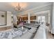 Bright, open-concept living space with a view into the kitchen and dining areas at 11210 Easthaven Pl, Duluth, GA 30097