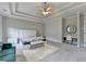Spacious main bedroom suite with a tray ceiling, plush carpet, and a vanity, creating a relaxing retreat at 11210 Easthaven Pl, Duluth, GA 30097