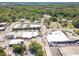 Aerial view featuring a town with commercial and residential buildings, plus tree-lined streets and convenient parking at 181 W Hightower Trl, Social Circle, GA 30025