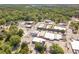 Aerial view highlighting commercial buildings in a town with green spaces, plus easy street and lot parking at 181 W Hightower Trl, Social Circle, GA 30025