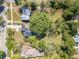 Overhead view showcasing the property's layout, mature trees, and street access at 181 W Hightower Trl, Social Circle, GA 30025