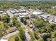 Aerial shot featuring the property, surrounding greenery, and its proximity to local shops at 181 W Hightower Trl, Social Circle, GA 30025