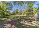 Large backyard with mature trees and plenty of space for outdoor activities at 181 W Hightower Trl, Social Circle, GA 30025