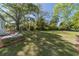 Spacious backyard with lush green grass and landscaping, perfect for outdoor activities at 181 W Hightower Trl, Social Circle, GA 30025