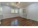 Bright bedroom with hardwood floors, classic trim, built-in shelving, and closet storage at 181 W Hightower Trl, Social Circle, GA 30025