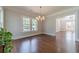 Dining room with hardwood floors, decorative lighting, and a view to another living space at 181 W Hightower Trl, Social Circle, GA 30025