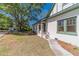 Charming home with white brick, green trim, and a well-manicured front yard at 181 W Hightower Trl, Social Circle, GA 30025