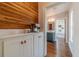 Hallway with built-in cabinetry, coffee bar, and access to a bathroom at 181 W Hightower Trl, Social Circle, GA 30025