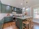 Stylish kitchen featuring custom cabinets, marble countertops, and stainless steel appliances at 181 W Hightower Trl, Social Circle, GA 30025