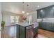 Modern kitchen with stainless steel appliances, a farmhouse sink, and custom cabinets at 181 W Hightower Trl, Social Circle, GA 30025