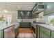 Gourmet kitchen featuring high-end appliances, a marble backsplash, and custom cabinetry at 181 W Hightower Trl, Social Circle, GA 30025