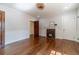 Bright living room with hardwood floors, traditional fireplace, classic trim, and neutral paint at 181 W Hightower Trl, Social Circle, GA 30025