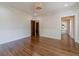 Open-concept living room featuring hardwood floors and doorways to other rooms at 181 W Hightower Trl, Social Circle, GA 30025