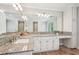 Well-lit bathroom with granite countertop, ample cabinet space, and a large mirror, perfect for morning routines at 2156 Fairway Cir, Duluth, GA 30096