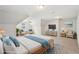 Bright bedroom featuring a plush bed, sitting area, and large windows, providing a bright and airy atmosphere at 2156 Fairway Cir, Duluth, GA 30096