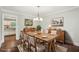 Dining room with hardwood floors and rustic wood table at 2156 Fairway Cir, Duluth, GA 30096