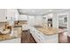 Kitchen with white cabinets, granite countertops, large center island, and stainless appliances at 2156 Fairway Cir, Duluth, GA 30096