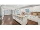 Kitchen with white cabinets, granite countertops and dark wood floors at 2156 Fairway Cir, Duluth, GA 30096