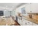 Spacious kitchen with granite countertops, stainless steel sink and cooktop at 2156 Fairway Cir, Duluth, GA 30096