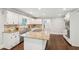 Bright, large kitchen featuring a center island and stainless steel appliances at 2156 Fairway Cir, Duluth, GA 30096