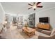 Comfortable living room featuring a fireplace, built-in bookshelves, and stylish furniture at 2156 Fairway Cir, Duluth, GA 30096
