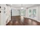 Spacious living area with hardwood floors, white trim and view of sunroom at 2156 Fairway Cir, Duluth, GA 30096