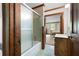 Bathroom with bathtub and glass shower, patterned tile floor and marble countertops at 3141 Burnt Hickory Nw Rd, Marietta, GA 30064
