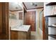 Bathroom with vanity and sink, glass shower, unique floor tiling and wood trim at 3141 Burnt Hickory Nw Rd, Marietta, GA 30064