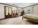 Bedroom with a vanity area, three windows and a bed with wood trim at 3141 Burnt Hickory Nw Rd, Marietta, GA 30064