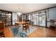 View of the dining room with hardwood floors, rug, and access to the outdoor patio via sliding glass doors at 3141 Burnt Hickory Nw Rd, Marietta, GA 30064