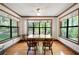 The dining room provides lots of natural light with its bright windows and hardwood floors at 3141 Burnt Hickory Nw Rd, Marietta, GA 30064